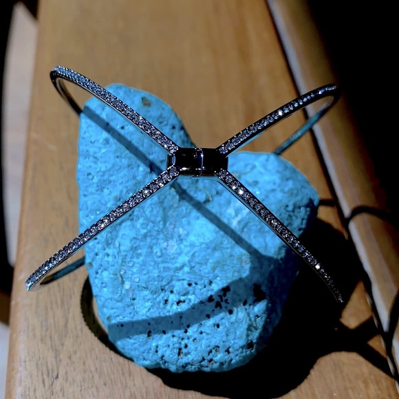 A beautiful silver bracelet with crystals on the outside of the bracelet. - Picture 2 of 8